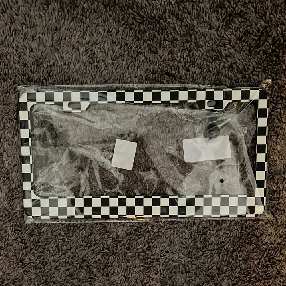 Checkerboard print black and white license plate cover